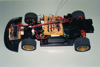 The fully working RC Car in it's final stage.  Microcontroller and receiver on the front, and motor controlling circuitry in the middle